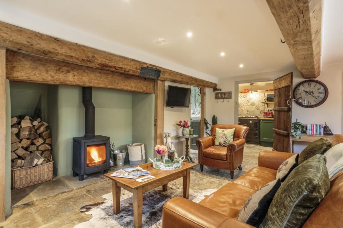 The living room with log burner at Blossom Cottage, Somerset