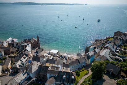 An aerial of the sea and Cawsand Coastal Retreat, Cornwall