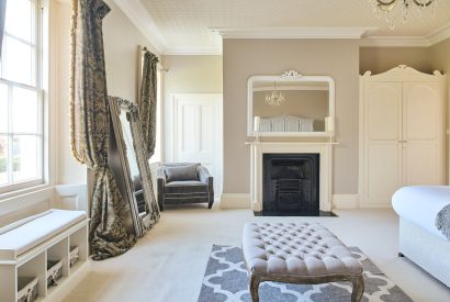 A double bedroom with open fire at Scott's Manor, Somerset