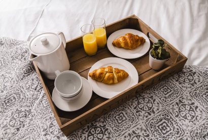 Breakfast on a tray in bed at Luxury Penthouse, Cotswolds