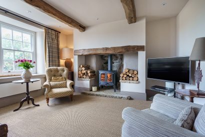 The living room with a log burner at Pen y Bryn, Abersoch