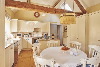 The kitchen and dining table at Milton Cottage, Cotswolds
