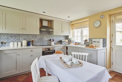 The kitchen and dining table at Kipling Cottage, Cotswolds