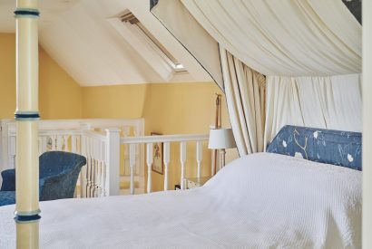 The four-poster bed at Kipling Cottage, Cotswolds