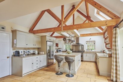 The kitchen with oak beams at Tennyson House, Cotswolds
