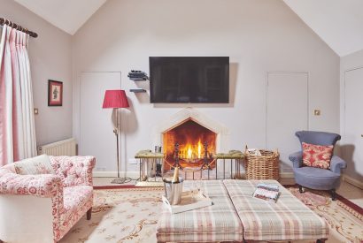 The living room with fireplace at Carroll Cottage, Cotswolds