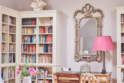 The living room with library at Carroll Cottage, Cotswolds