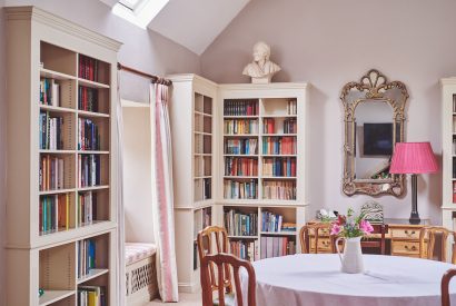 The living room with library at Carroll Cottage, Cotswolds