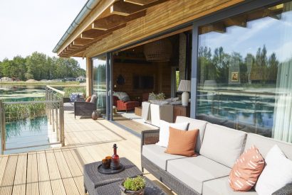 The balcony with lake view at Barn Owl Cabin, Cotswolds