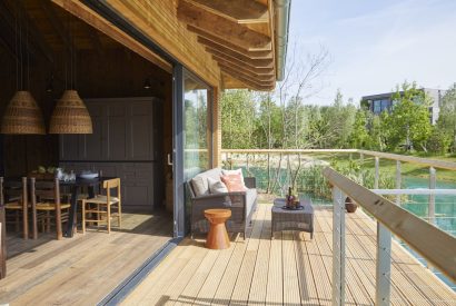 The balcony with lake view at Barn Owl Cabin, Cotswolds