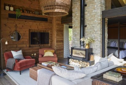 The living room with log burner at Barn Owl Cabin, Cotswolds