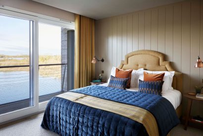 A double bedroom with lake view at The Reserve, Cotswolds