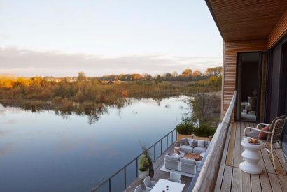 The balcony with lake view at The Reserve, Cotswolds