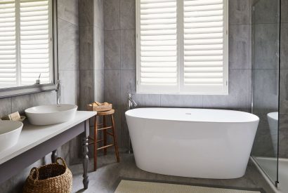 The bathroom with free standing bath at Alder Grand Suite, Cotswolds