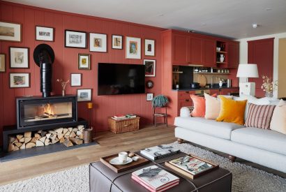 The living room with log burner at Alder Grand Suite, Cotswolds