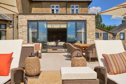 The patio with sun loungers at Lakeside Manor, Cotswolds
