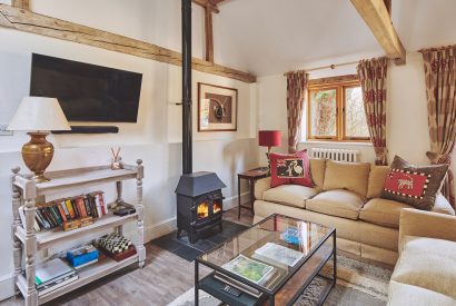 The living room with log burner at Jersey Barn, Chiltern Hills