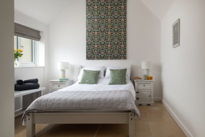 The master bedroom with vaulted ceiling at Farmyard Cottage, Wiltshire