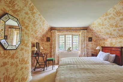 A twin bedroom at Withington Grange, Cotswolds 