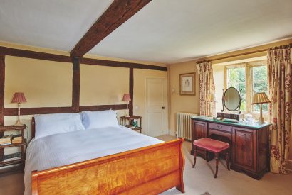 A king-size bedroom at Withington Grange, Cotswolds 