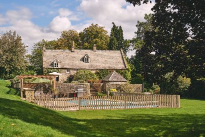 The garden and swimming pool at Withington Grange, Cotswolds 