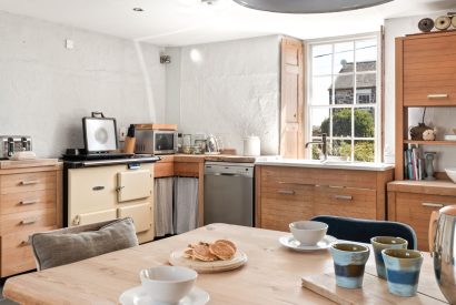 Breakfast on the dining table in the open-plan kitchen at Chapel Cottage, Pembrokeshire