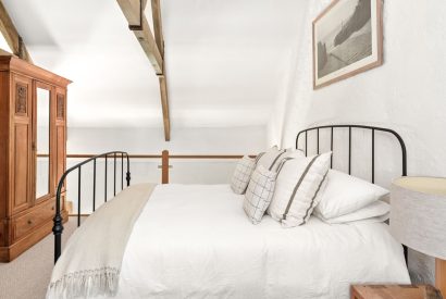 A double bedroom with oak beams at Chapel Cottage, Pembrokeshire