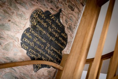 A wall plaque on the staircase at Chapel Cottage, Pembrokeshire