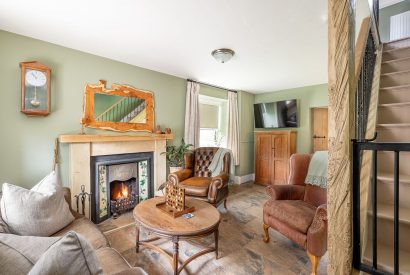 The living room with a fireplace at High Moor Cottage, Yorkshire