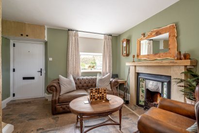 The living room with a fireplace at High Moor Cottage, Yorkshire