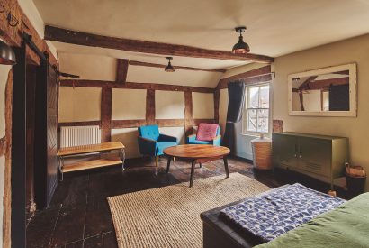 A bedroom with sitting area at Hay Market House, Powys