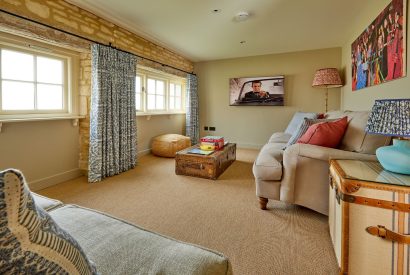 A sitting room at The Barn at Ampneyfield, Gloucestershire