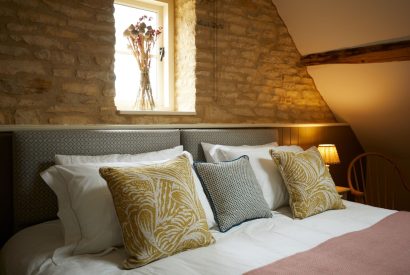 A double bed at Orchard Stable, Cotswolds