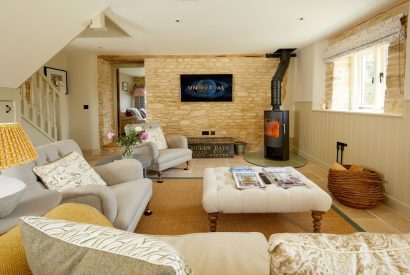The living room with log burner at Orchard Stable, Cotswolds
