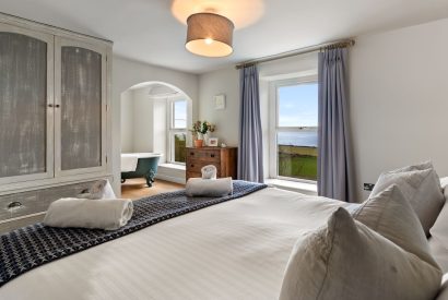 A super king size bedroom at Channel View, Oxwich 