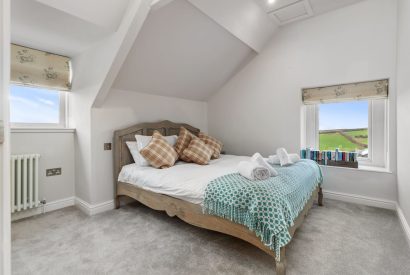 A king size bedroom at Channel View, Oxwich