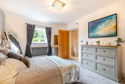 A king size bedroom at Skyfall, Cheshire