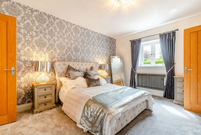 A king size bedroom at Skyfall, Cheshire