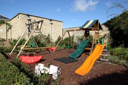 The outdoor play area at Chaucer Cottage, Cotswolds