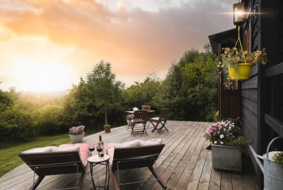 The patio and view at Hooting Owl Retreat, Somerset