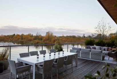 The balcony with lake view at The Reserve, Cotswolds