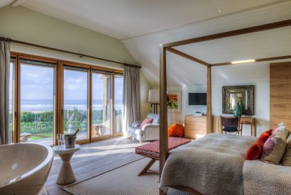 A four poster bedroom at Ocean View, Cornwall