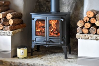 The living room with a log burner at Pen y Bryn, Abersoch