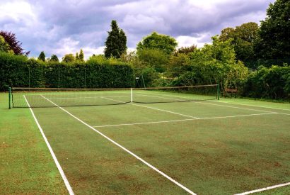 The tennis court at Cotswold Retreat, Cotswolds