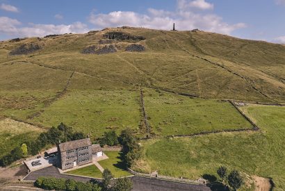 Aerial view of Rye Top Farm, Uppermill, Peak District