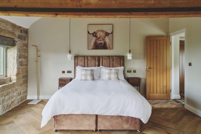 A king size bedroom at Rye Top Farm, Uppermill, Peak District