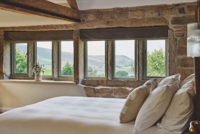 A king size bedroom at Rye Top Farm, Uppermill, Peak District