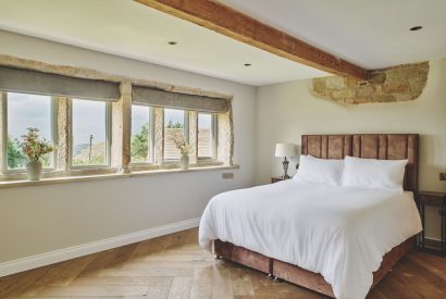 A king size bedroom at Rye Top Farm, Uppermill, Peak District