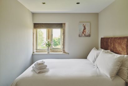 A king size bedroom at Rye Top Farm, Uppermill, Peak District