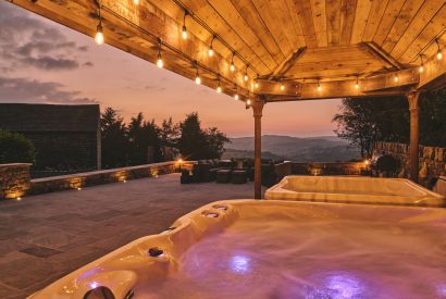 The hot tubs at sunset at Rye Top Farm, Uppermill, Peak District